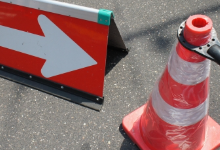 traffic cone and arrow sign