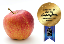red apple and superstar medallion over white background